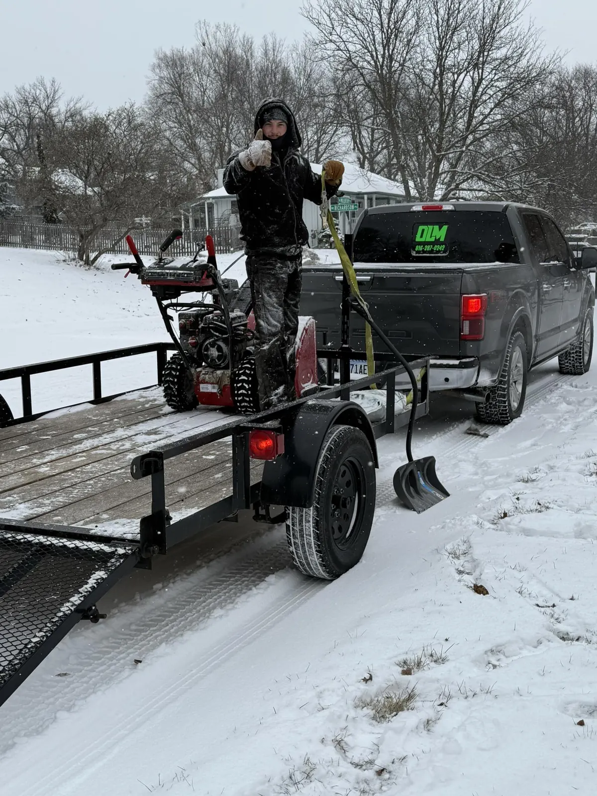 Owens Land Management team with branded truck and snow blower equipment